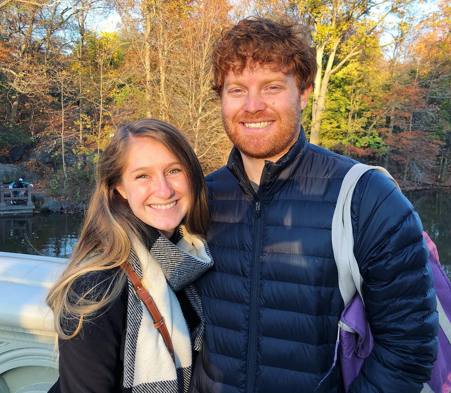 Polaroid photo of a couple posing together on a bed with the date 06/10/19 written on the polaroid.