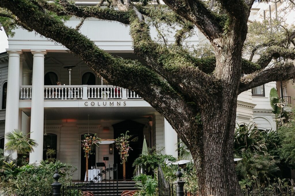 Cropped photo of the exterior of the top floor of an old stone building.