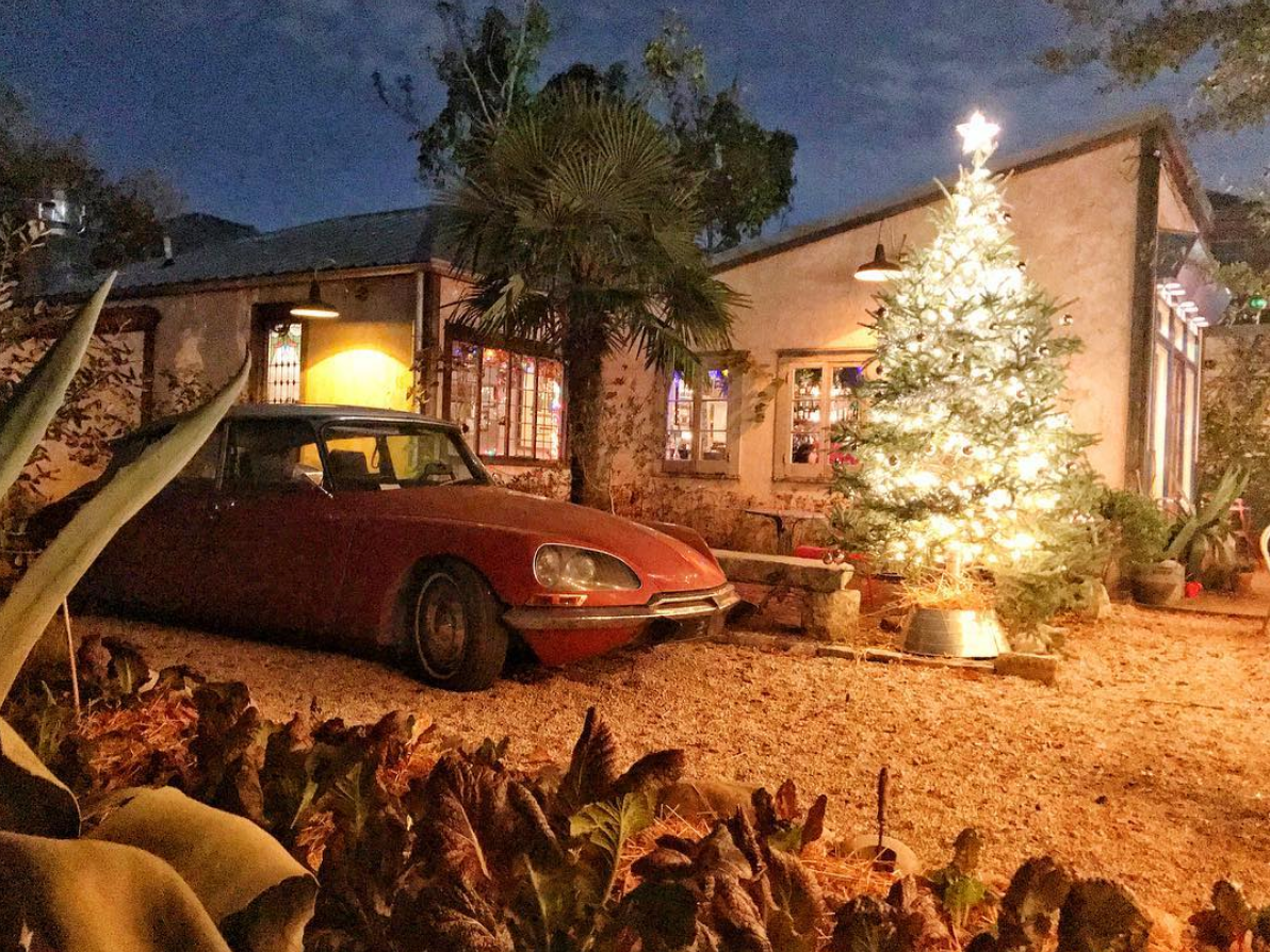 Cropped photo of the exterior of the top floor of an old stone building.