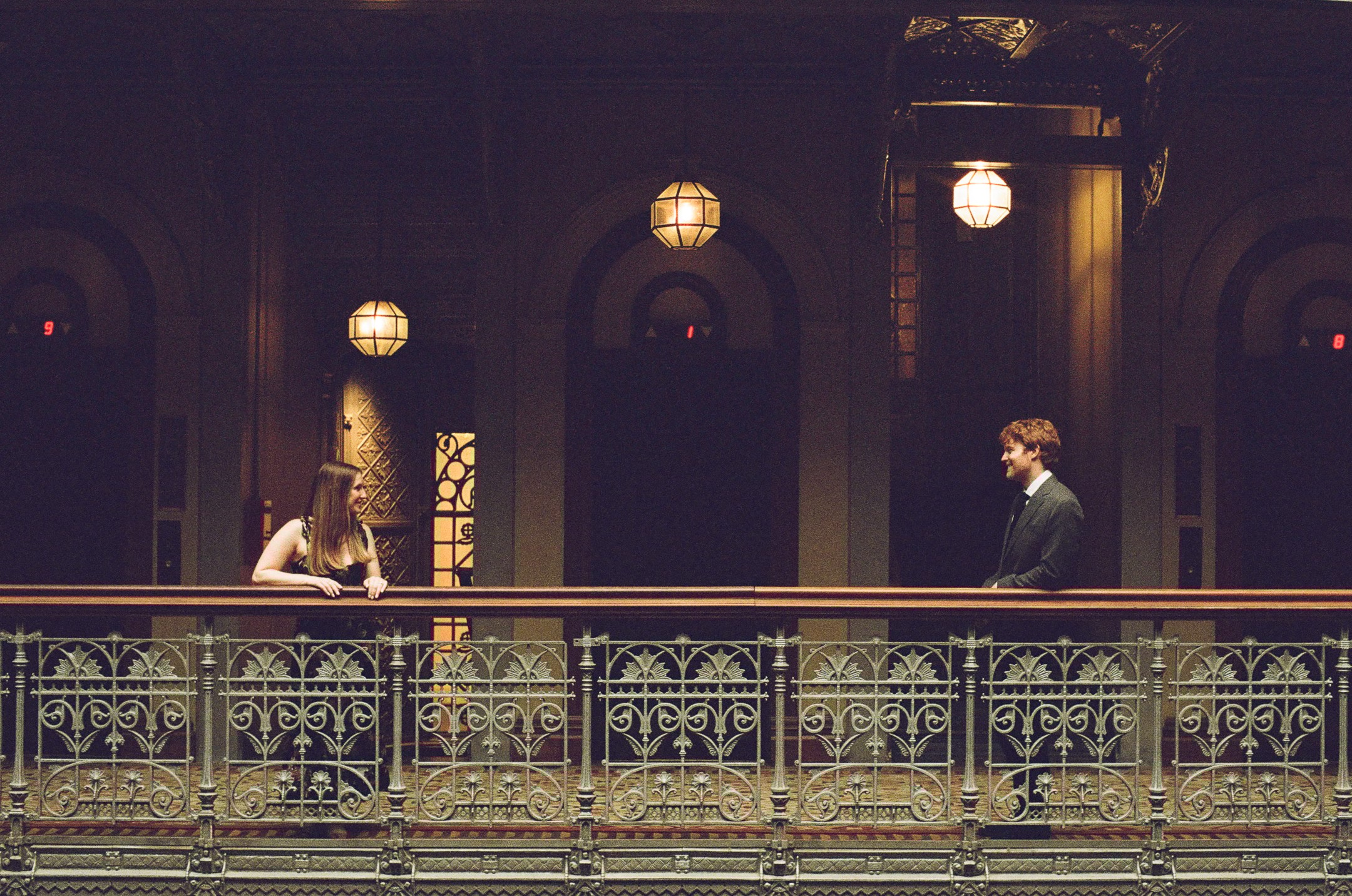 Delicate flowers taped to a wall.
